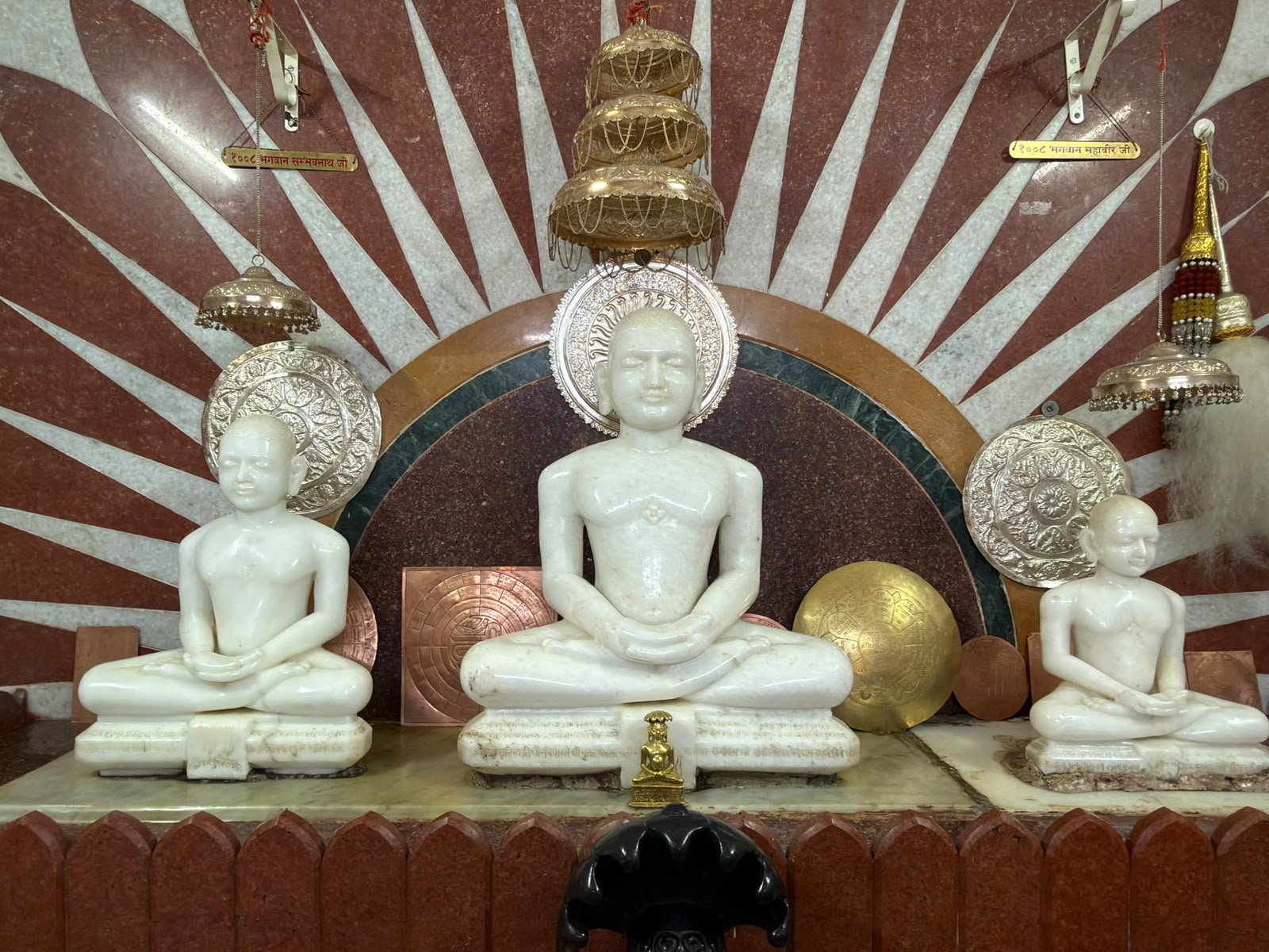 Devotees participating in worship before the main shrine